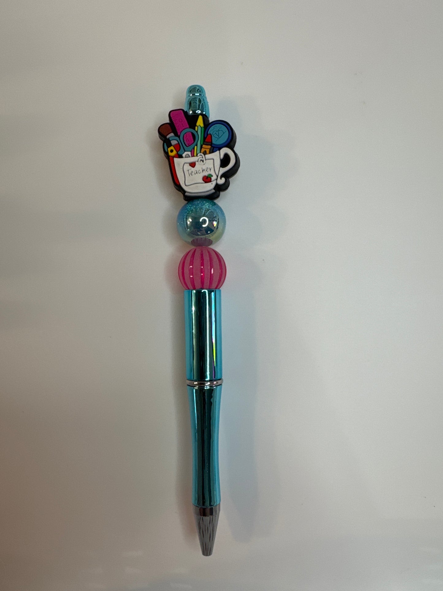 Teacher cup with school supplies