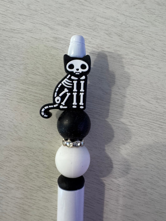 Black cat on one side other side skeleton cat