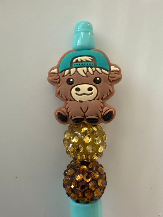 Bow highland cow with cap