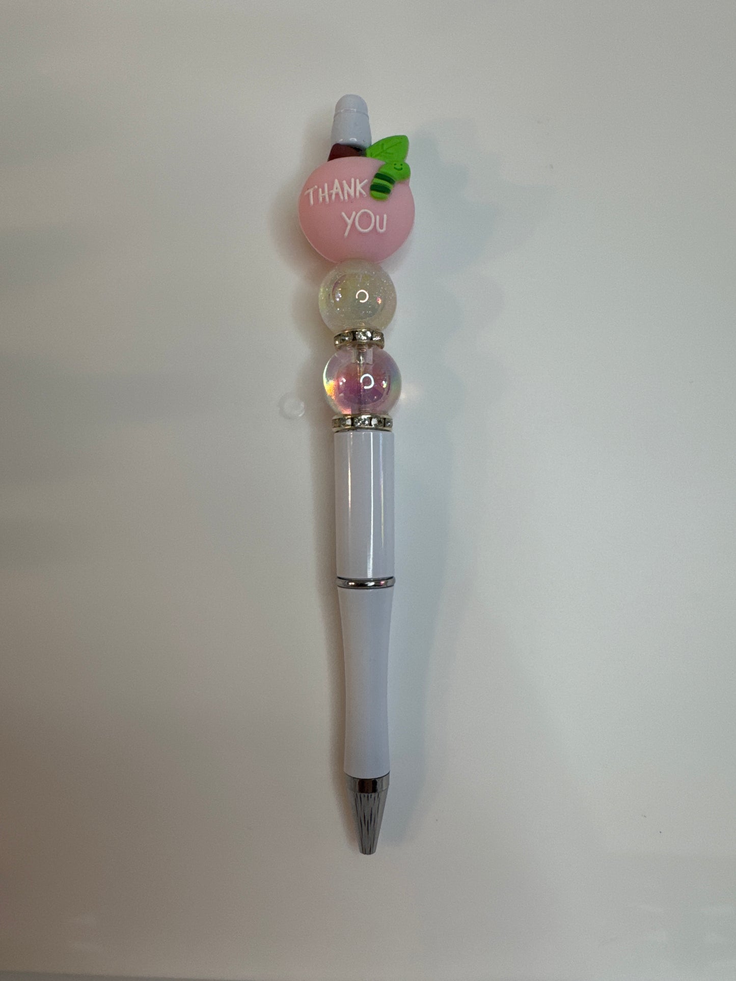 Pink teacher apple with thank you on reverse side