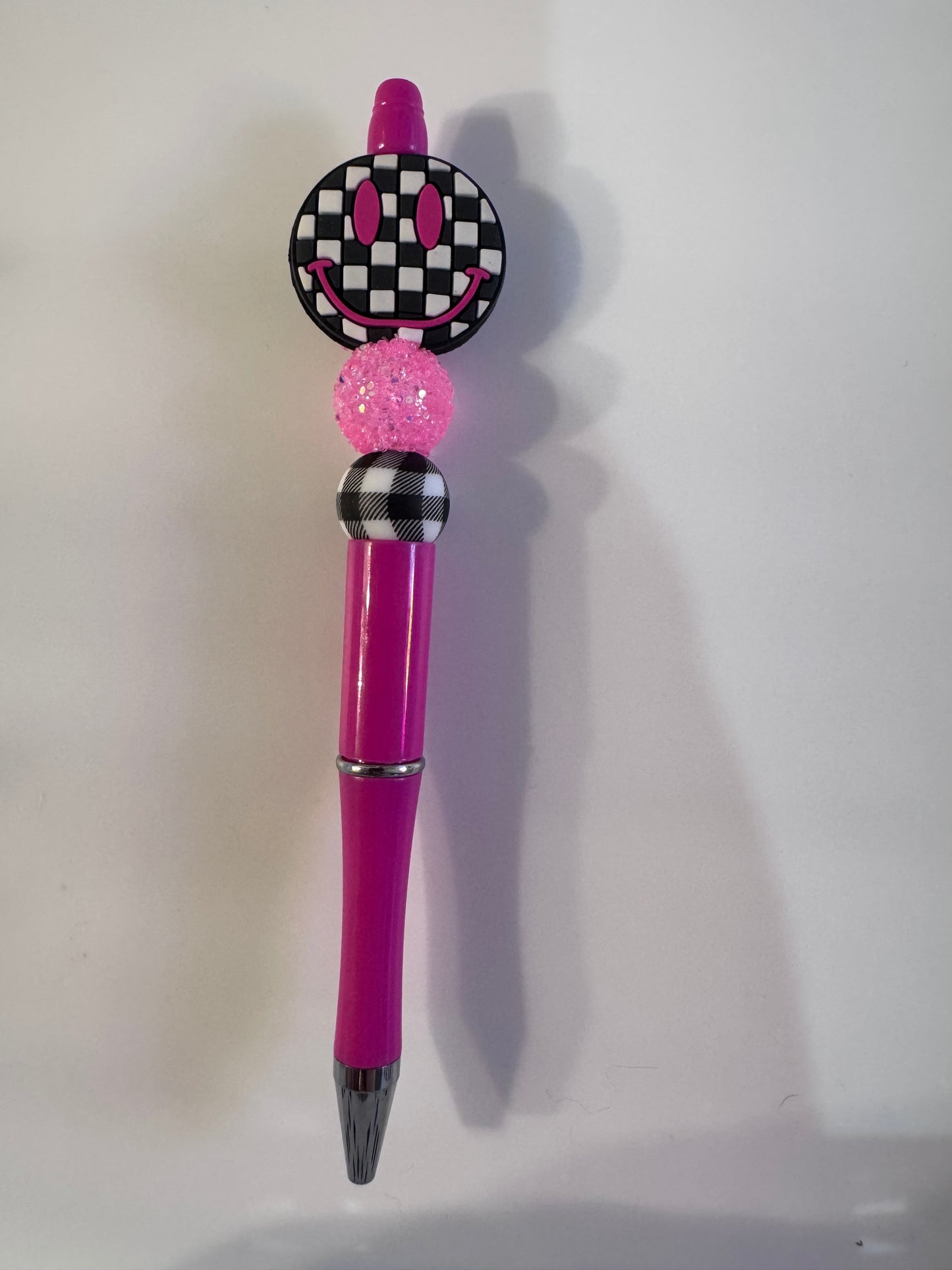 Checkered pink smiley face