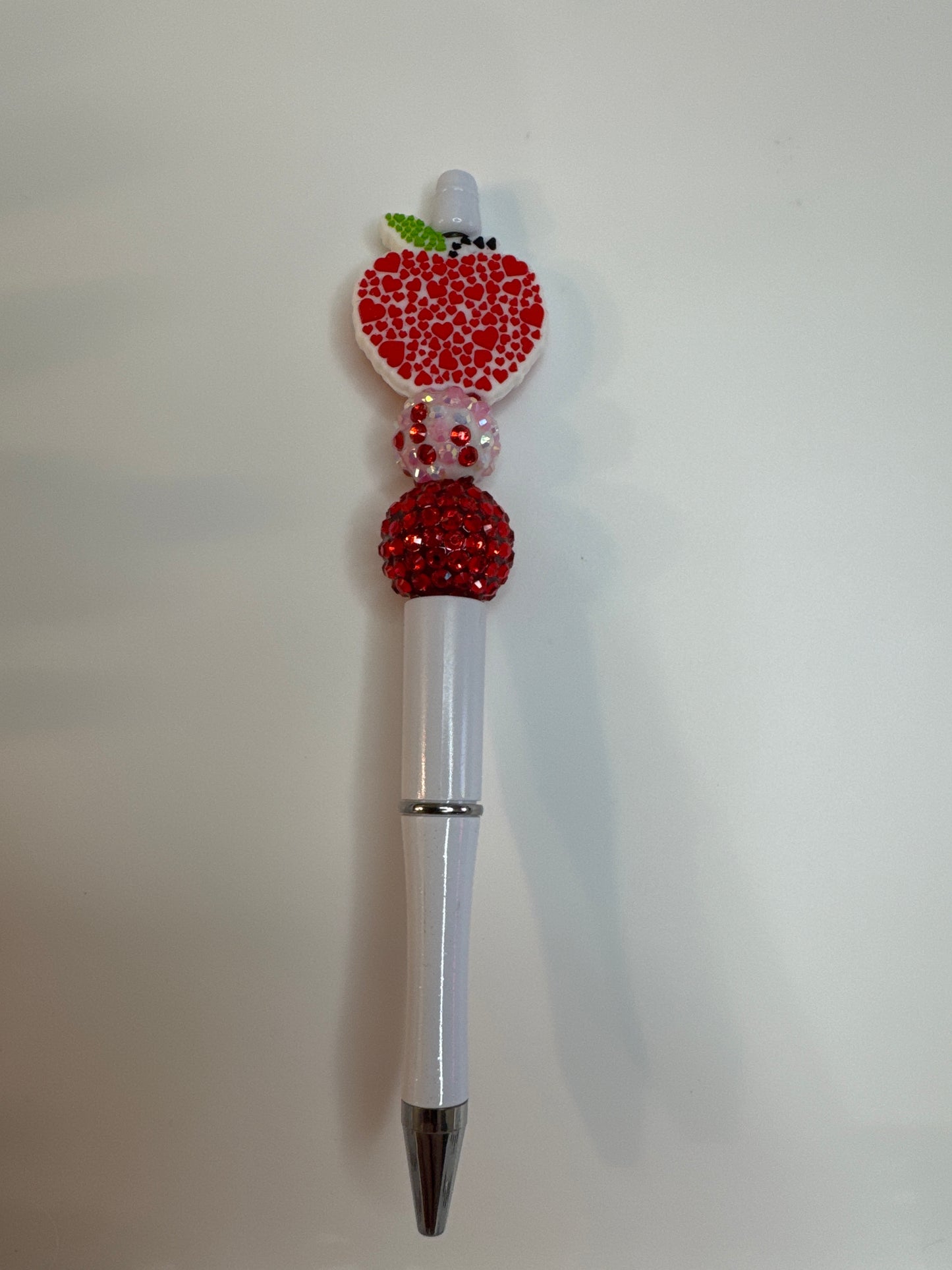 Teacher Apple made out of tiny hearts