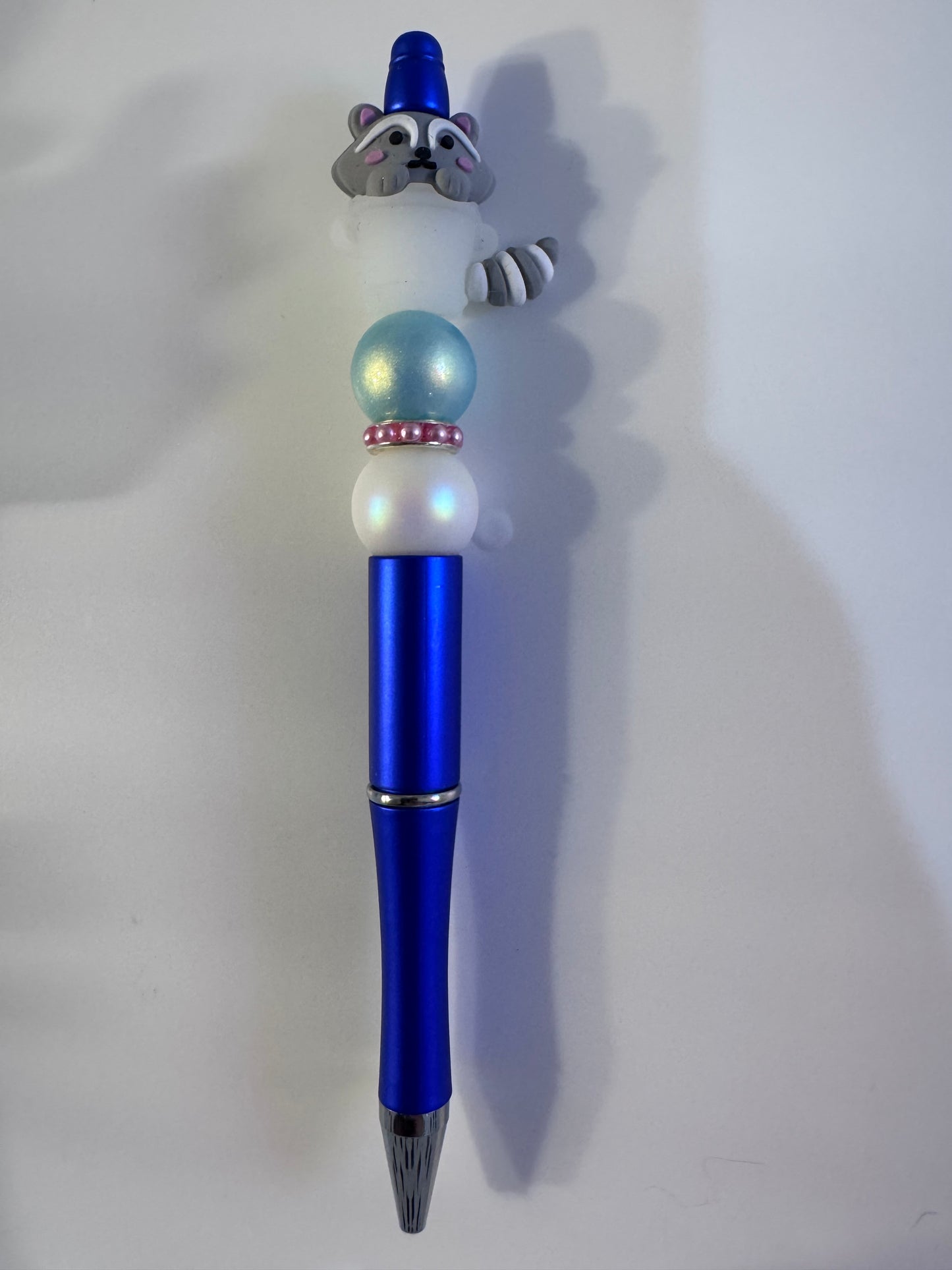 Glow in dark raccoon in trash can