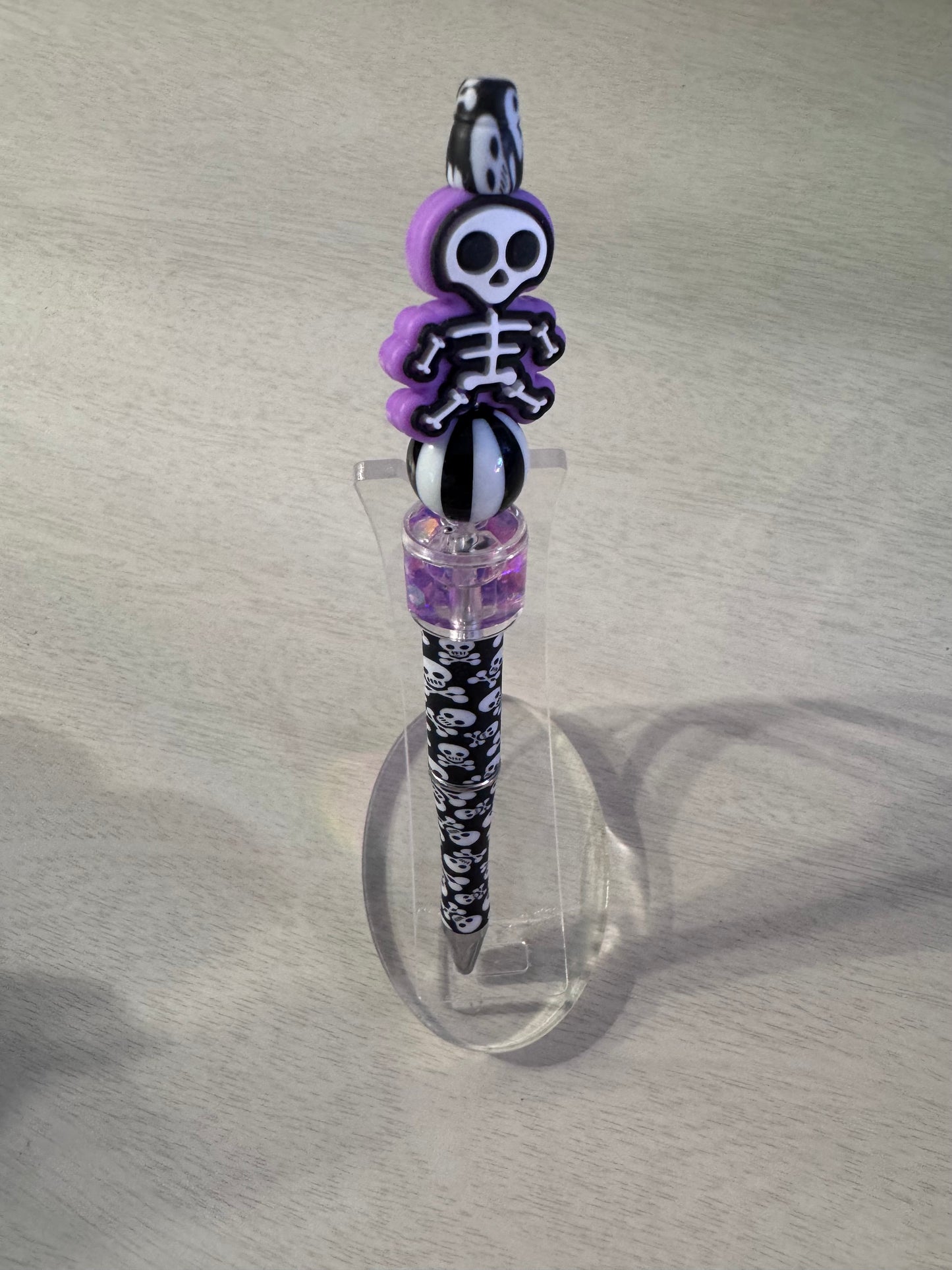 Purple skeleton with water bead