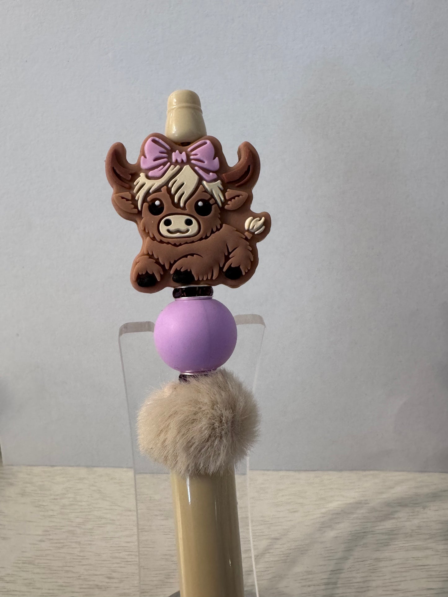 Cute highland cow with bow