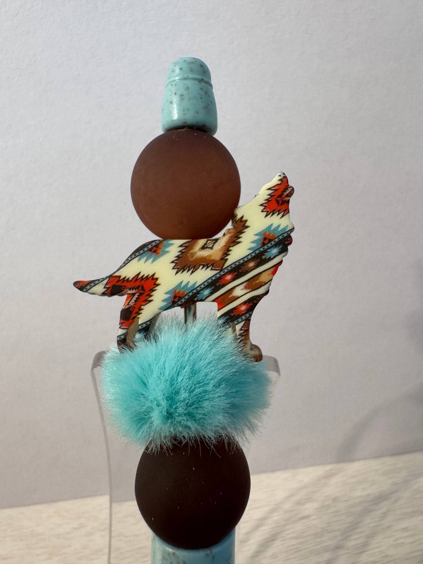 Wolf/coyote with turquoise puff