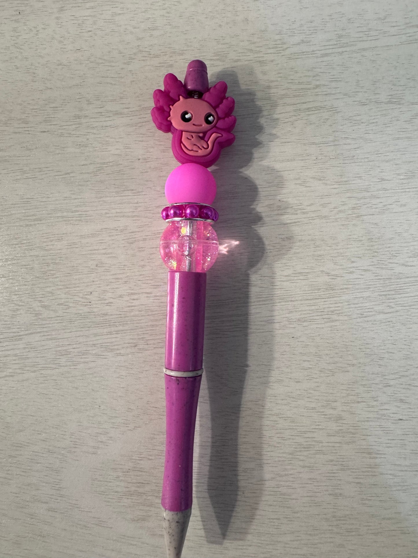 Pink Axolotl with water bead