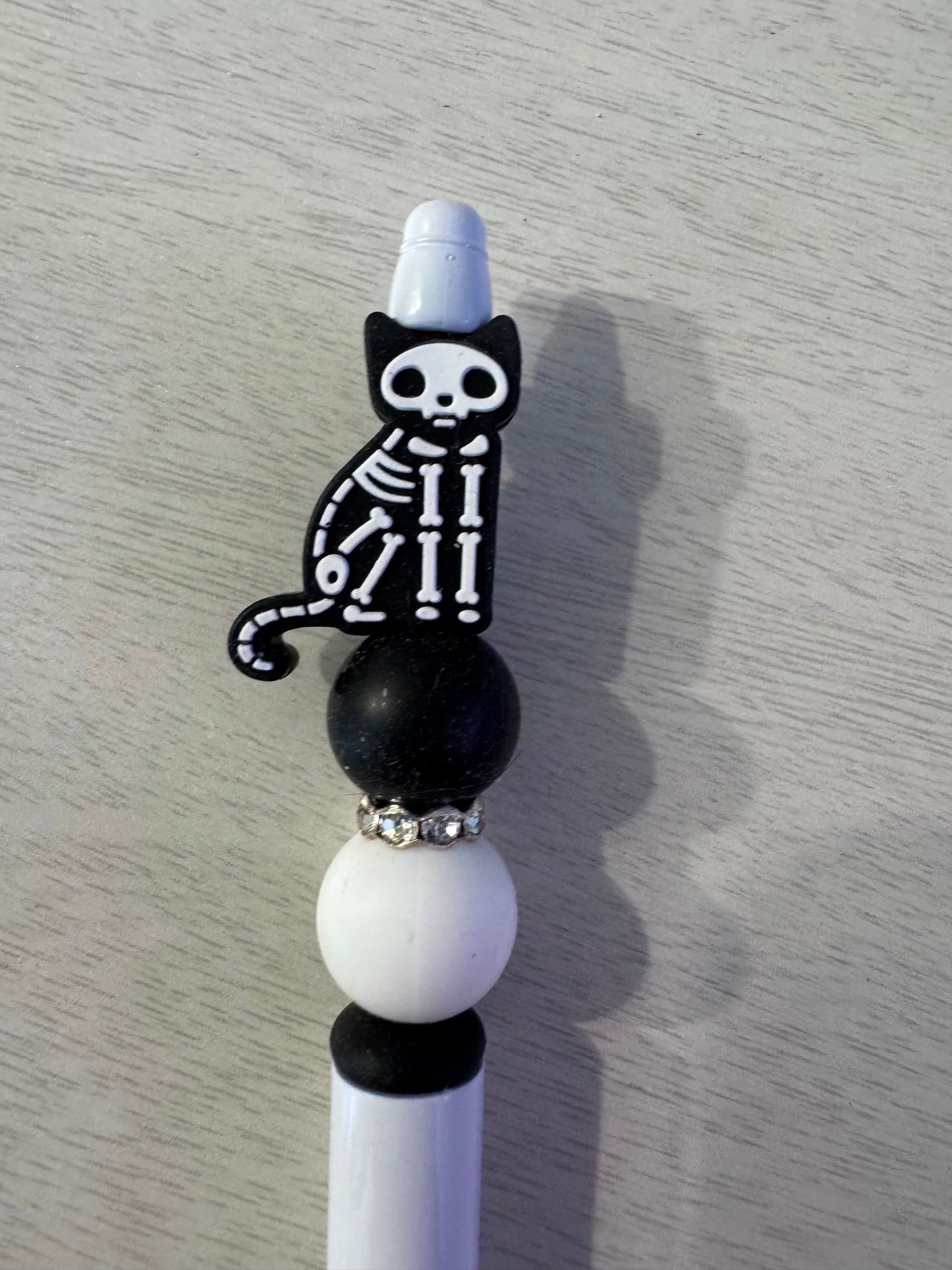 Black cat on one side other side skeleton cat