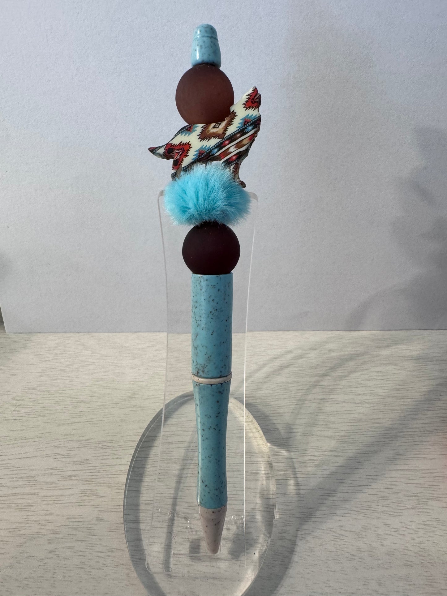 Wolf/coyote with turquoise puff