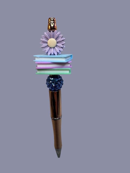 Bookish book stack with purple flower