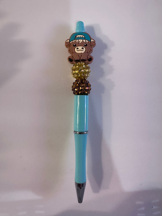 Bow highland cow with cap