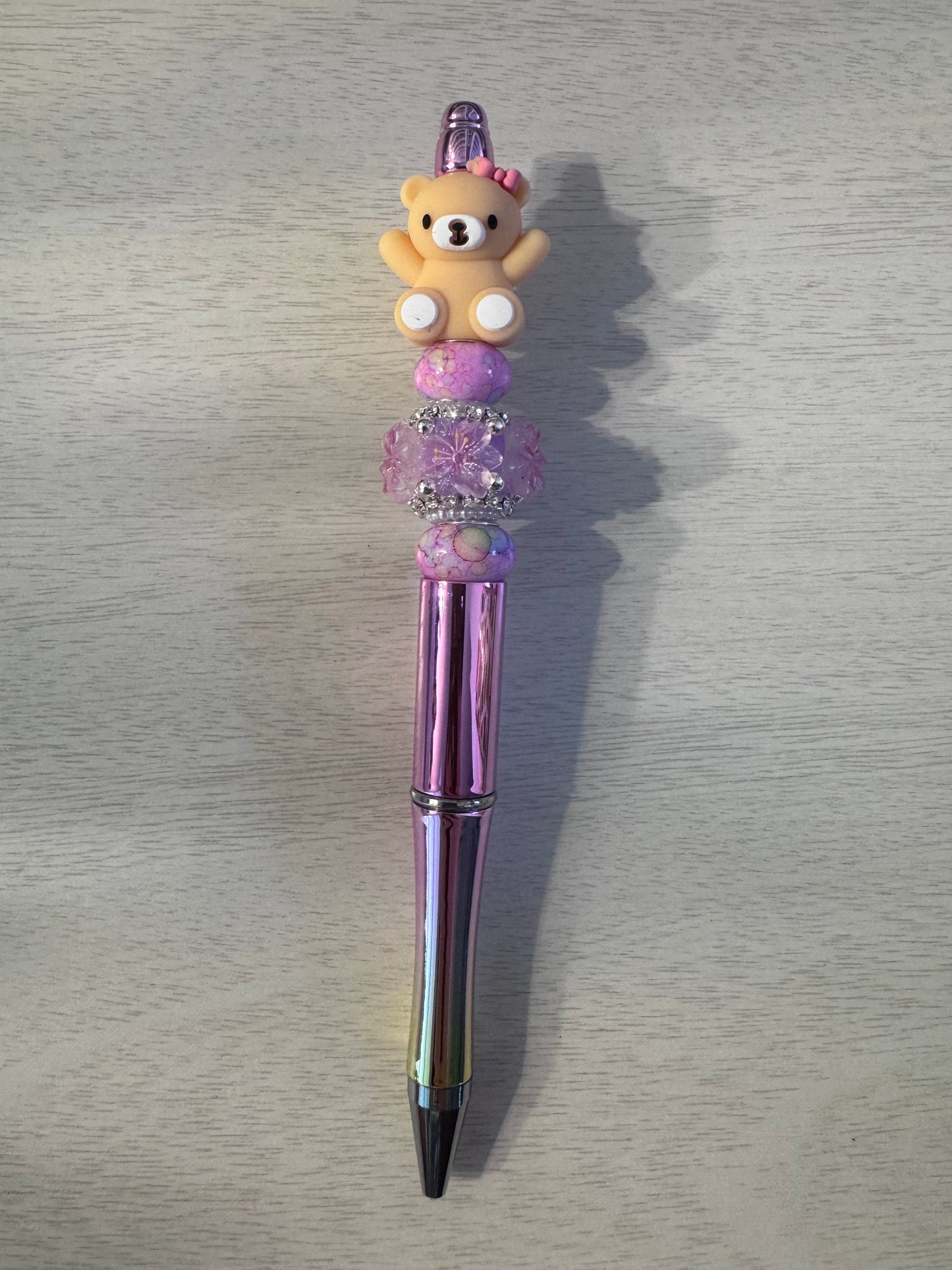 Teddy bear with bow and pink specialty bead
