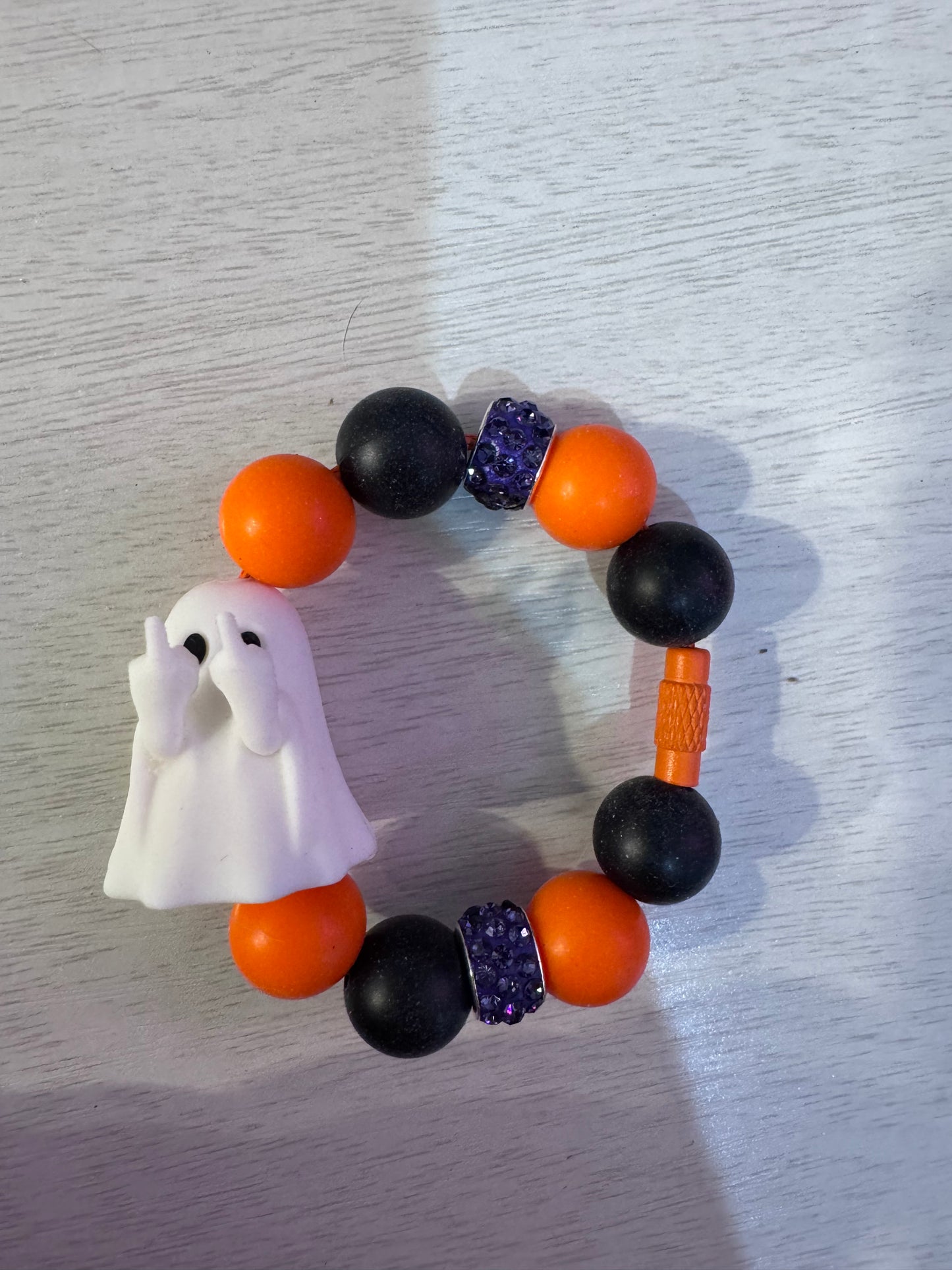 Halloween ghost giving the bird.