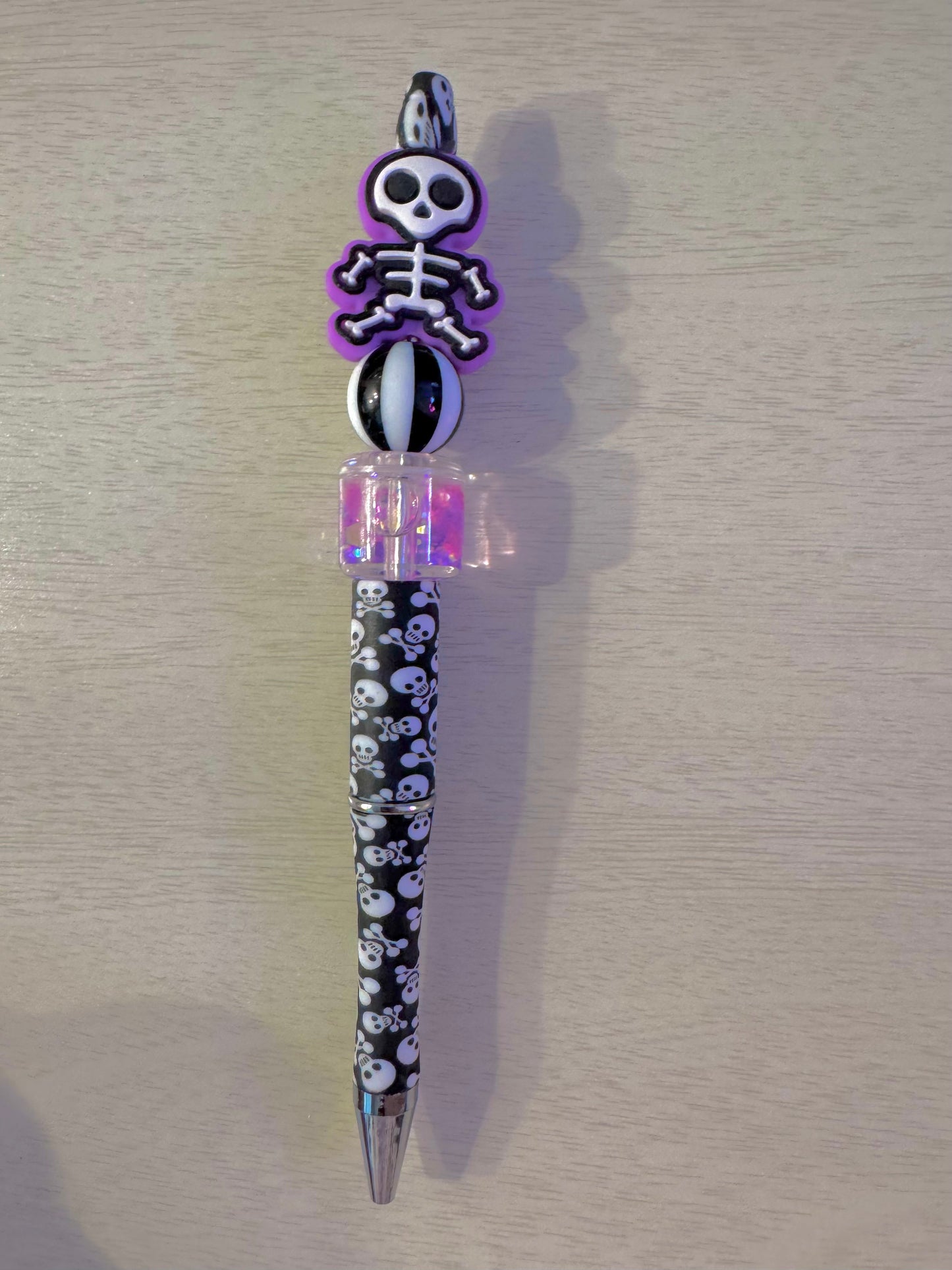 Purple skeleton with water bead