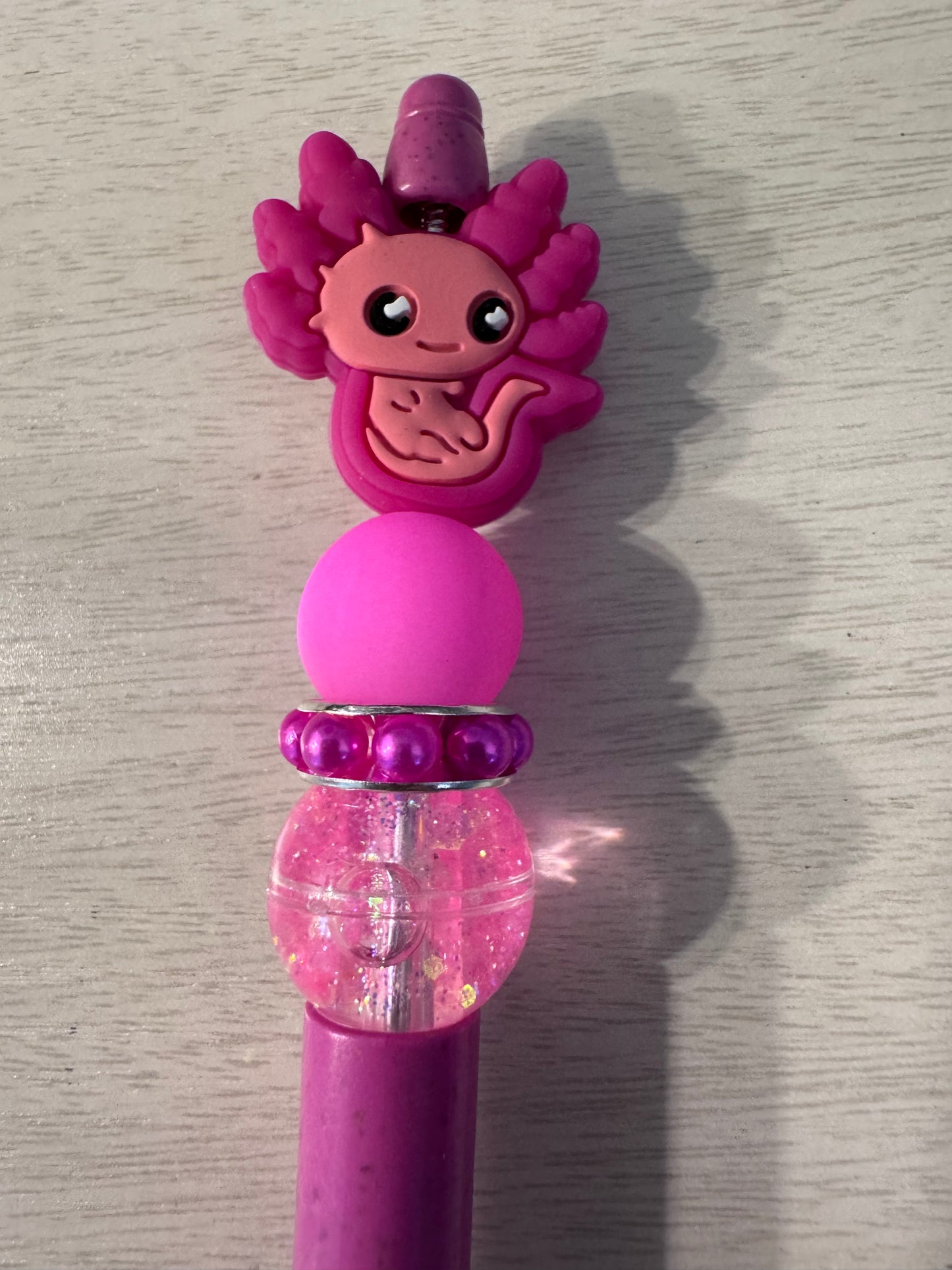 Pink Axolotl with water bead