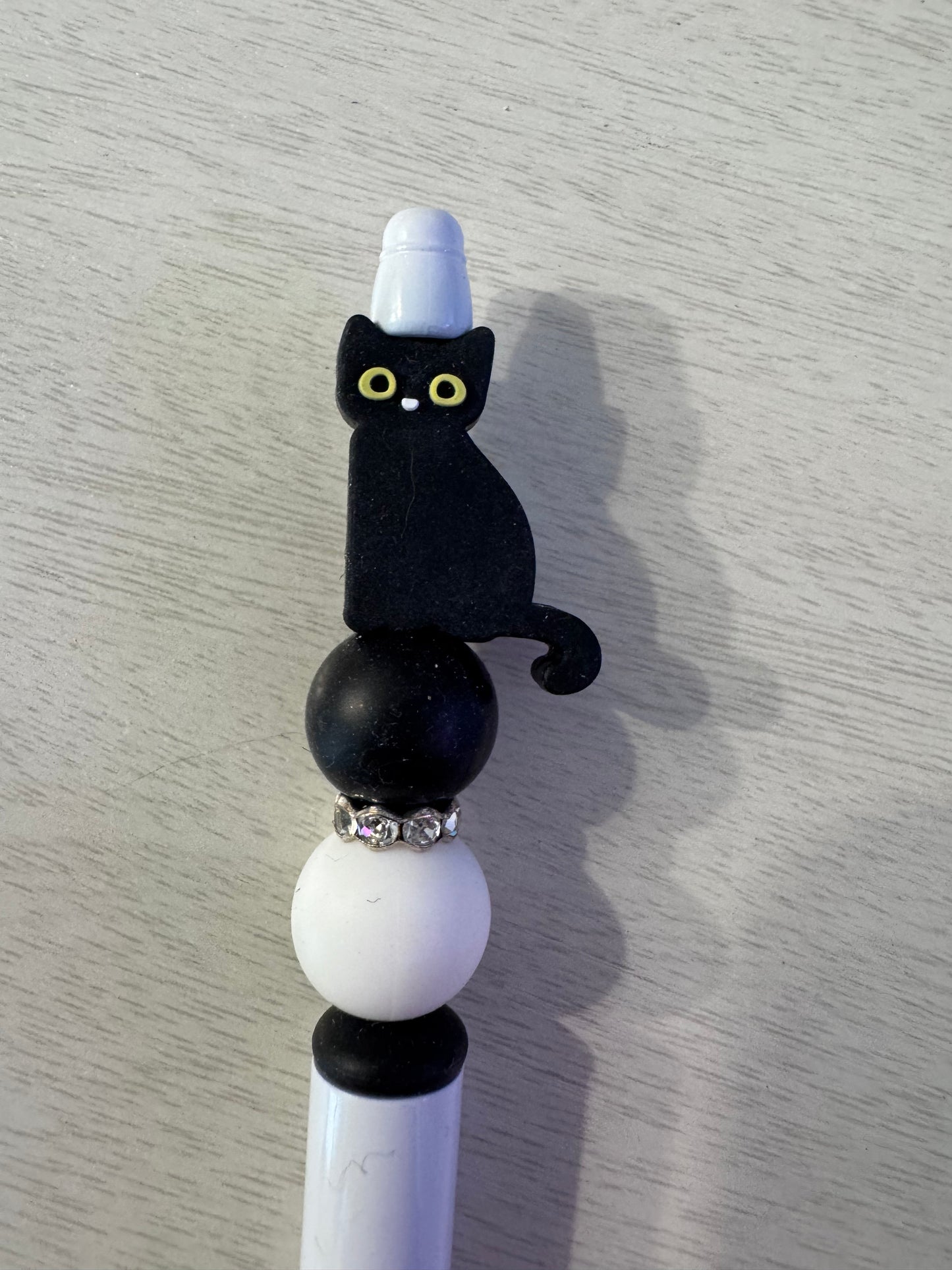 Black cat on one side other side skeleton cat