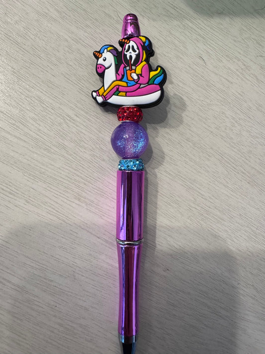 Scream, ghost face in unicorn suit in unicorn floaty drinking.