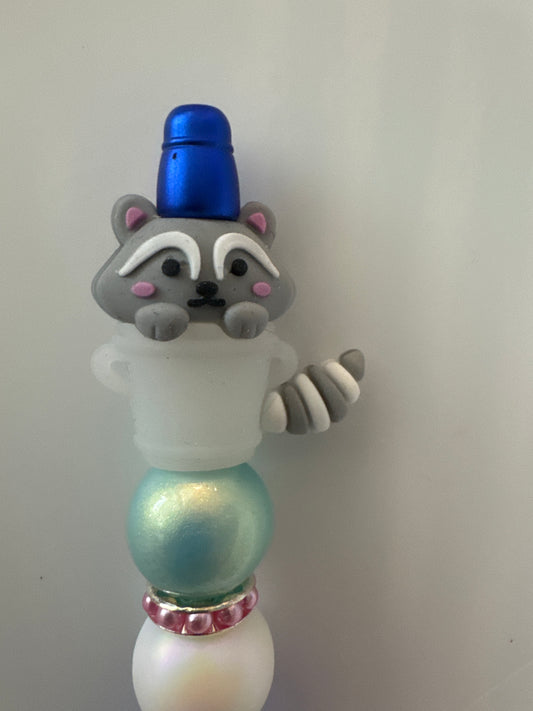 Glow in dark raccoon in trash can