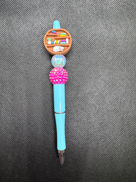 Round bookcase with cat