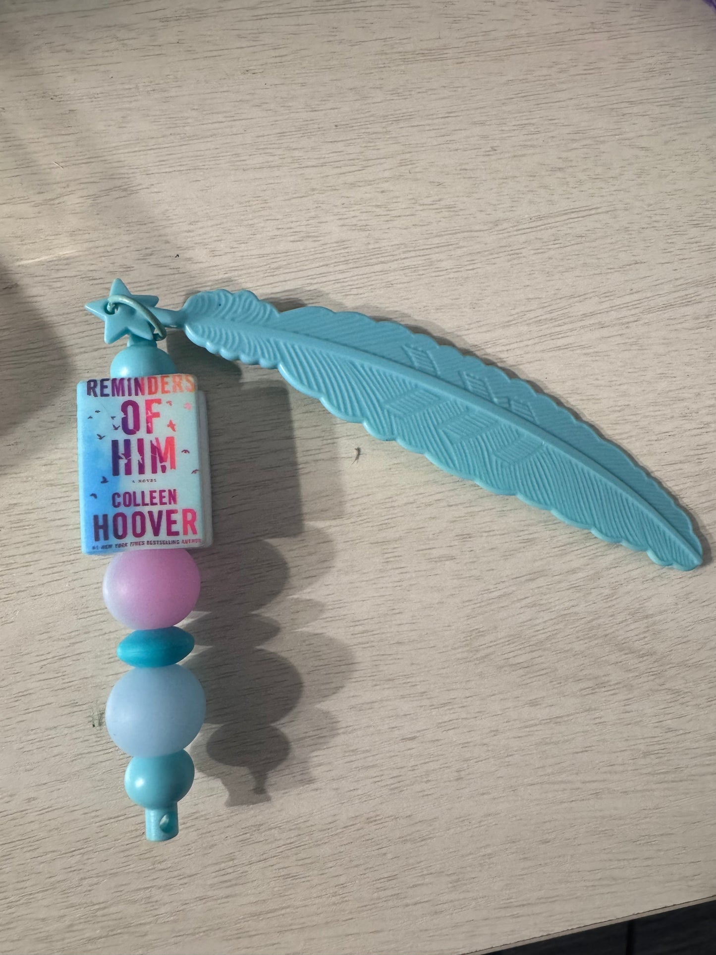 Reminder of him by Colleen Hoover feather bookmark